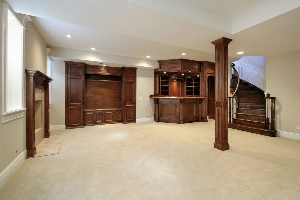 Basement in new construction home with wood cabinetry